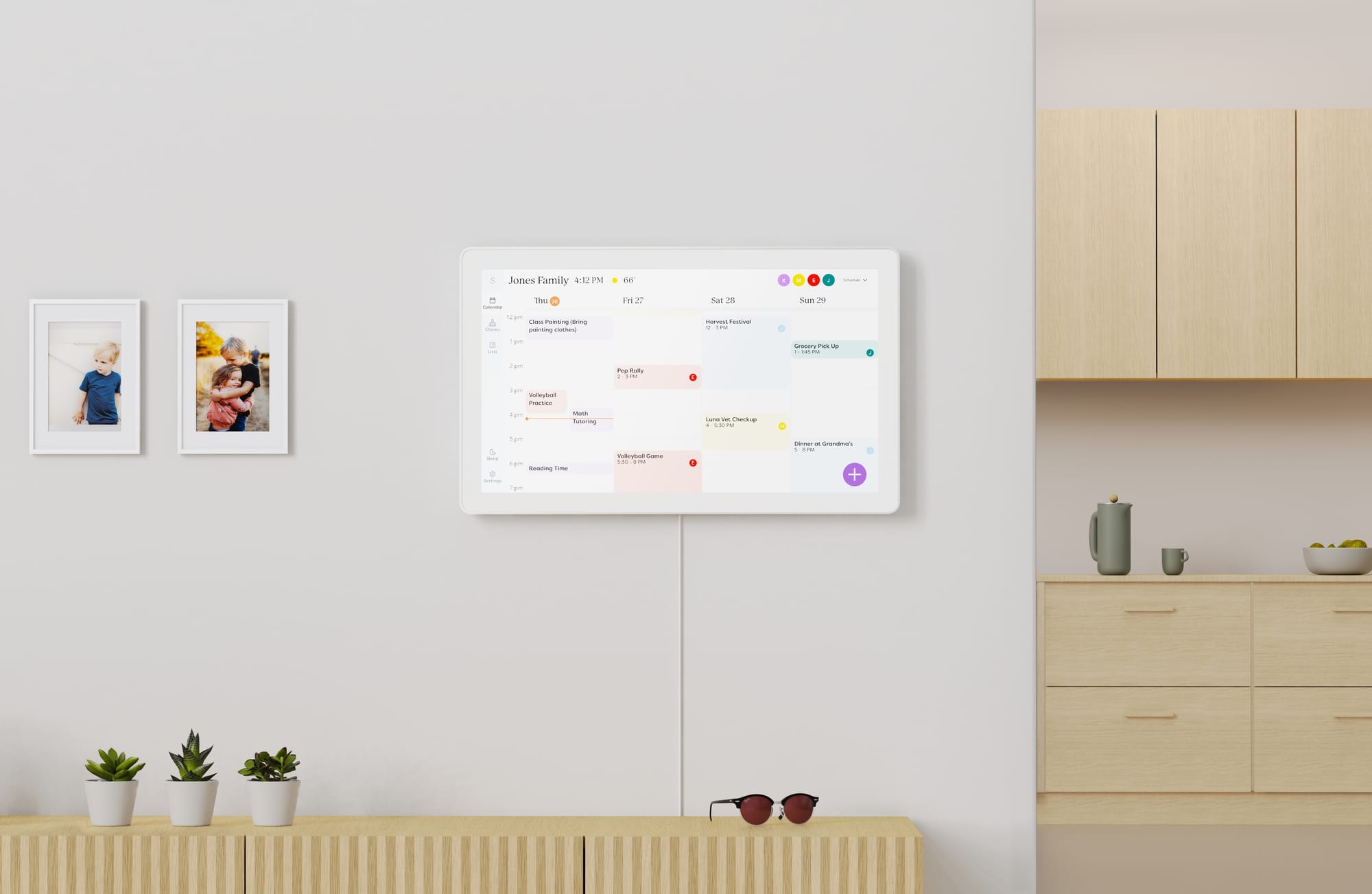 A picture of the Skylight Max, a 27" screen mounted to the wall that displays the whole family's calendars.