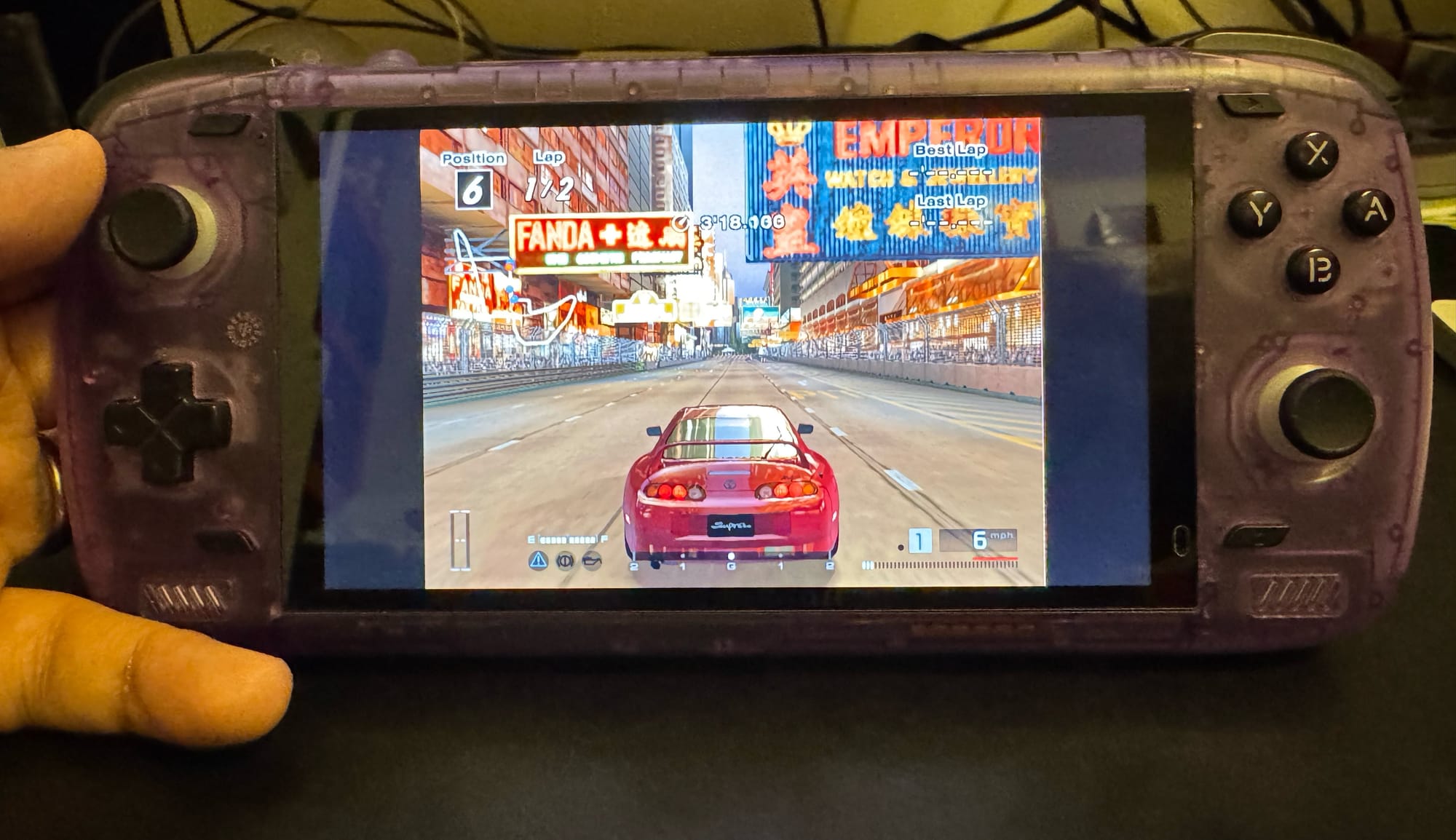 PlayStation 2 game Gran Turismo 4 running on the Odin 2 Pro handheld.