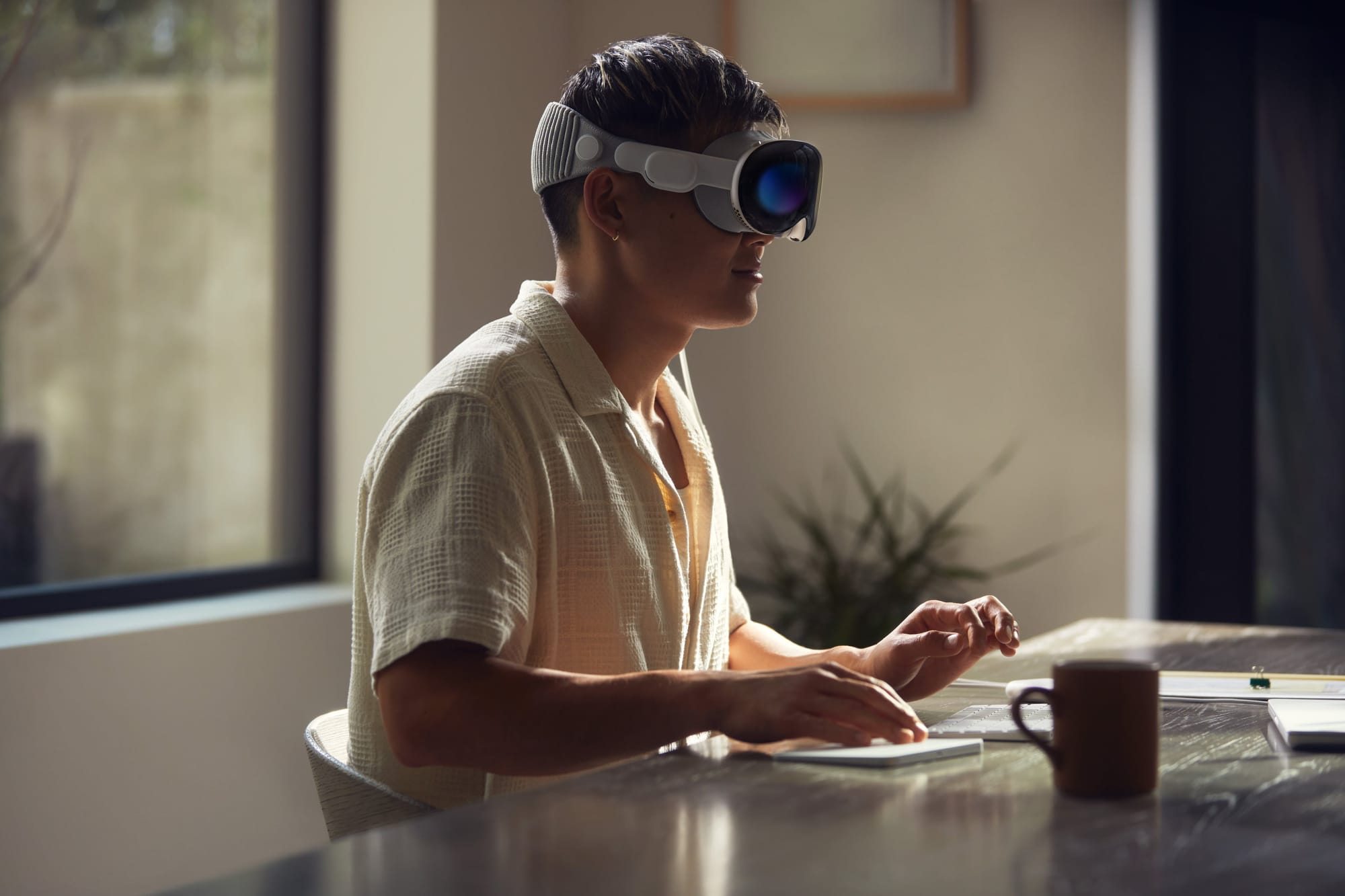 A man wears the Apple Vision Pro headset.