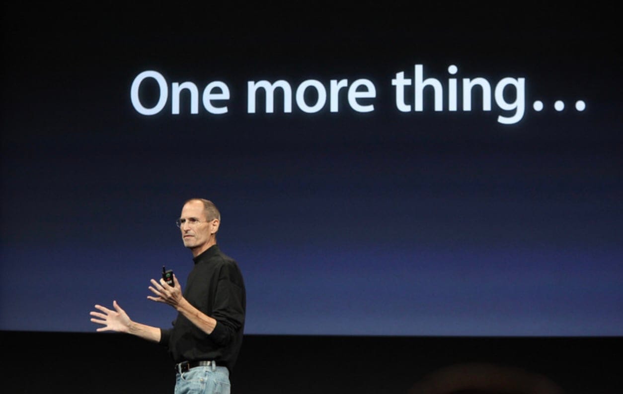Steve Jobs presenting at an Apple Event in front of a slide that says "One more thing..."