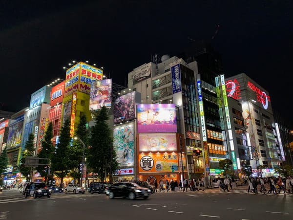 A night-time photo of a street corner in Akihabara, Tokyo's famed electronics district