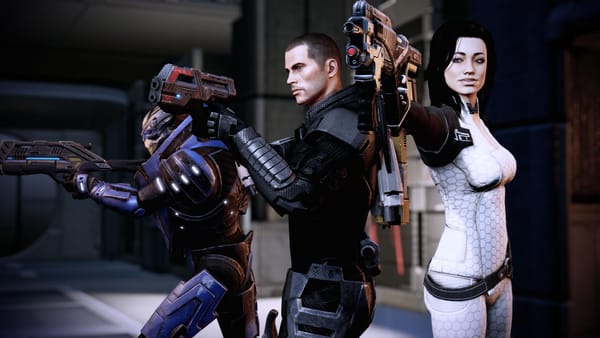 Three characters from the game Mass Effect 2 stand holding guns.